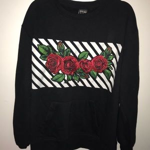 Comfy black pull over sweater with rose detail